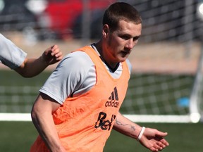 Saskatoon's Brett Levis, right, battles with his Whitecaps FC 2 teammate Kadin Chung during the Caps' MLS training camp in Tucson, Ariz. Levis is among a crop of young Canadians vying for an MLS roster spot.