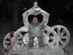 Event artistic director Peter Fogarty poses in one of a number of ice sculptures during the Frosted Gardens ice park and sculpture display at the Bessborough Hotel, which opened to the public, Monday, February 01, 2016.