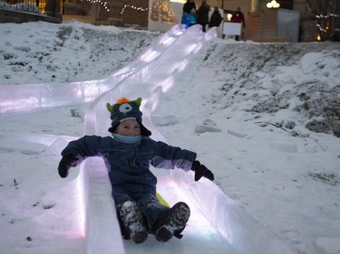 Deklan Voss goes for a ice slide during the Frosted Gardens ice park and sculpture display at the Bessborough Hotel, which opened to the public, Monday, February 01, 2016.
