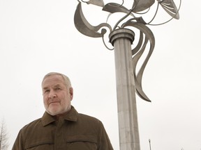 Saskatoon artist Douglas Bentham, posing in front of his Unfurled sculpture Thursday, questions whether the City of Saskatoon has the proper mechanisms in place to implement a policy to incorporate public art into major city projects.