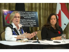 Carolyn Bennett, Minister of Indigenous and Northern Affairs, left, and Jody Wilson-Raybould, Minister of Justice and Attorney General of Canada, speak to media in Saskatoon about Missing Women and Girls, Wednesday, February 10, 2016.