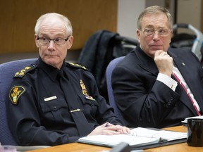 Saskatoon police  chief Clive Weighill, left, and Mayor Don Atchison at the Board of Police Commissioners meeting at city hall on Wednesday.