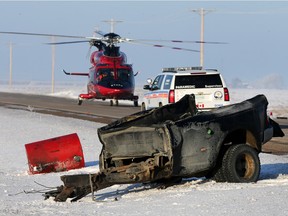 Emergency crews on the scene of a two-vehicle accident west of Langham that killed three people and left four others injured.