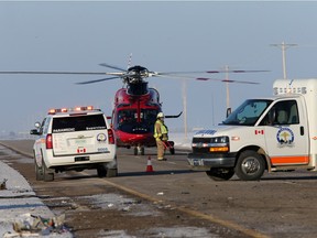 Emergency crews on the scene of a crash on Highway 16 west of Langham that killed three and injured five early Monday morning.