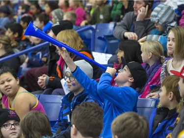 The lower bowl in SaskTel Centre was packed in the morning on February 22, 2016 as schoolchildren made up the audience in a rare day game for the Saskatoon Blades against the Brandon What Kings. Laeten of Hugh Cairns School blows the horn.