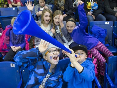 The lower bowl in SaskTel Centre was packed in the morning on February 22, 2016 as schoolchildren made up the audience in a rare day game for the Saskatoon Blades against the Brandon What Kings. Laeten of Hugh Cairns School blows the horn.