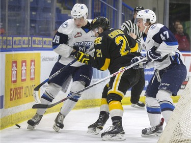 The lower bowl in SaskTel Centre was packed in the morning on February 22, 2016 as schoolchildren made up the audience in a rare day game for the Saskatoon Blades against the Brandon What Kings. Blades Ryan Graham and Nolan Reid take out Wheat Kings' Tyler Coulter behind the net.