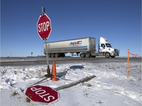 A temporary stop sign and a downed stop sign at the intersection of Rural Route 3083 and the eastbound lanes of Highway 16 in February of 2016.