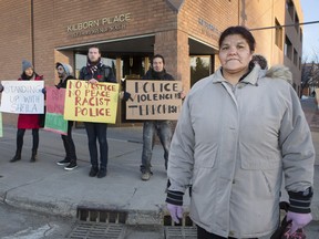 Sheila Tataquason, right, with supporters outside the provincial courthouse on Thursday, Feb. 25, 2016, is suing Saskatoon police for damages she suffered when she was attacked by a police dog and arrested for a crime she didn't commit.