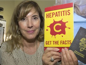 Lesley Gallagher, with a model of a liver and some literature about Hepatitis C on her desk, is a nurse practitioner specializing in Hepatitis C.