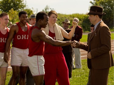 Stephan James as Jesse Owens (C) and Jason Sudeikis as Larry Snyder (R) in "Race," a Focus Features release.