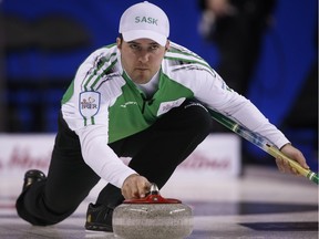 Saskatchewan skip Steve Laycock delivers a rock as his team plays Quebec during curling action at the Brier in Calgary, Tuesday, March 3, 2015.