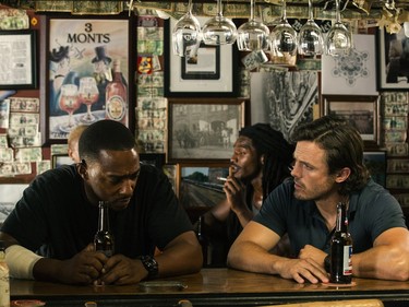 Anthony Mackie (L) and Casey Affleck star in "Triple 9."