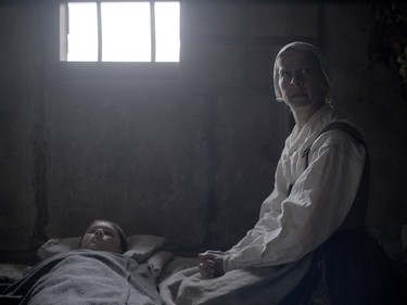 Kate Dickie as Katherine (R) and Harvey Scrimshaw as Caleb in "The Witch."