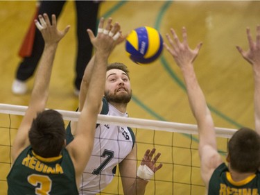 University of Saskatchewan Huskies' Andrew Nelson hits the ball against the University of Regina Cougars in CIS Men's Volleyball action, February 20, 2016.