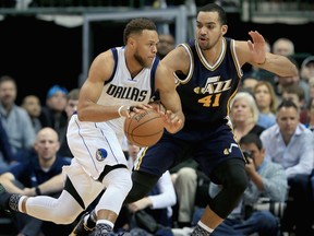 Justin Anderson of the Dallas Mavericks drives to the basket against Saskatoon-born Trey Lyles (right) of the Utah Jazz in the first quarter at American Airlines Center on Feb. 9, 2016 in Dallas, Texas.