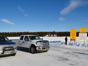 Trucks travel on the Wollaston Lake ice road in this March 2014 file photo.