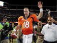 FILE - In this Sept. 5, 2013, file photo, Denver Broncos quarterback Peyton Manning (18) walks off the field after an NFL football game against the Baltimore Ravens, in Denver. Manning had the biggest day by an NFL QB in 44 years, throwing seven touchdown passes in directing Denver's 49-27 rout of the Baltimore Ravens, who had upset Denver in double overtime in the playoffs seven months earlier. (AP Photo/Joe Mahoney, File)