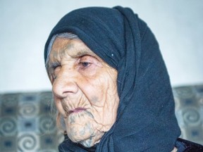 Grandmother Amona Ali, 104, sits inside a suite at a hotel in Surrey on Wednesday. The refugee family fled Syria and is being temporarily housed in the city. Ric Ernst/PNG