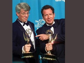 FILE - In this Sept. 13, 1998 file photo, Peter Tolan, left, and Gary Shandling pose with their Emmy awards for outstanding writing for a comedy series award for &ampquot;The Larry Sanders Show,&ampquot; at the 50th Annual Primetime Emmy Awards in Los Angeles. Shandling, who as an actor and comedian pioneered a pretend brand of self-focused docudrama with &ampquot;The Larry Sanders Show,&ampquot; died, Thursday, March 24, 2016 of an undisclosed cause in Los Angeles. He was 66. (AP Photo/Victoria Arocho, File)