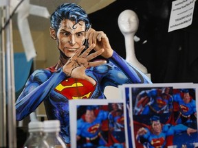 Over a 12 hour period, all the while live streaming on the internet, Kay Pike transforms herself using body paint and latex into Superman at her home in Calgary, Alta., Saturday, March 19, 2016.THE CANADIAN PRESS/Jeff McIntosh