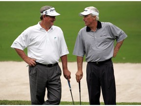 (L) Bobby Watkins and (R) Curtis Strange chat on the 10th hole during the first round of the Administaff Small Business Classic at the Woodlands Country Club on Oct. 17, 2008 in Woodlands, Texas.