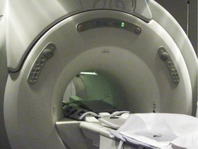 An MRI machine is seen at a clinic in Calgary Thursday November 28, 2002. Dr. Alan Moody suggests scientists are missing a chance to see the big picture when it comes to medical images. Moody says images like X-rays, MRIs and CT-scans could provide a treasure trove of information if they were systematically studied.