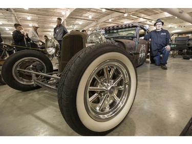 Owen Jeancart's sits for a photograph with his 1929 Model A Ford custom made to resemble a Second World War B17 bomber at the Draggins 56th annual Car Show at Prairieland Park on Friday, March 25th, 2016.