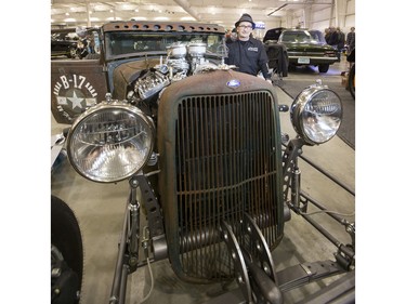 Owen Jeancart sits for a photograph with his 1929 Model A Ford custom made to resemble a Second World War B17 bomber at the Draggins 56th annual Car Show at Prairieland Park on March 25, 2016.
