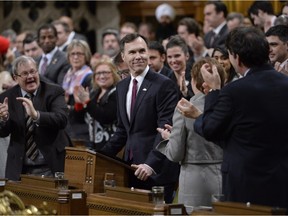 Minister of Finance Bill Morneau is given a standing ovation as he arrives to deliver the federal budget in the House of Commons on Parliament Hill in Ottawa on Tuesday, March 22, 2016.