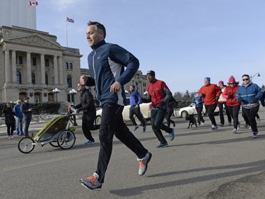 Cam Broten and numerous Saskatchewan NDP candidates go for a run around Wascana Lake in Regina, March 20, 2016.