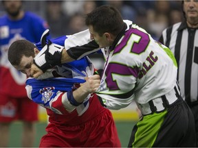 Saskatchewan Rush defender Nik Bilic lands a punch during a fight with Toronto Rock defender Billy Hostrawser in NLL action on Saturday, March 26th, 2016. (Liam Richards/Saskatoon StarPhoenix)