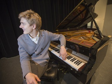 Jan Lisiecki, classical pianist, poses for a photograph at the piano he will be playing at Churchill Community School in La Ronge later in the day during a Cameco sponsored tour of northern Saskatchewan on March 3, 2016.