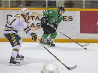 University of Saskatchewan Huskies forward Kohl Bauml move the puck against the University of Alberta Golden Bears during second period CIS Men's Hockey action on March 5, 2016.
