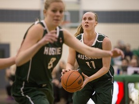 University of Saskatchewan Huskies guard Laura Dally moves the ball against the University of Alberta Pandas in CIS Women's Basketball action on Saturday, February 13, 2016.