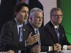 (From left) Prime Minister Justin Trudeau, Quebec Premier Philippe Couillard and Saskatchewan Premier Brad Wall