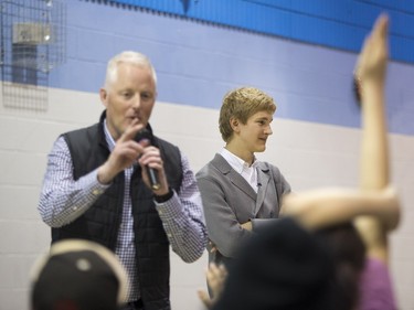 Jonathan Huntington, director of coporate relations for Cameo (L) takes questions from student for Jan Lisiecki, classical pianist, at Senator Myles Venne elementary school in La Ronge during a Cameco sponsored tour of northern Saskatchewan on March 3, 2016.