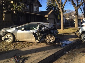Police were at the scene after reports that a truck crashed into five parked vehicles before its driver ran off in Saskatoon Thursday morning.