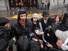 Media talk to Jeremy Roy and Charles Neil Curly, two homeless men from Saskatchewan outside the Vancouver railway station and bus depot on March 9, 2016