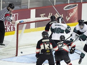 University of Saskatchewan Huskies' Parker Thomas, right, scores the winning goal in their 3-2 victory over the Carleton Ravens during fourth overtime period CIS championship hockey action in Halifax on March 17, 2016.