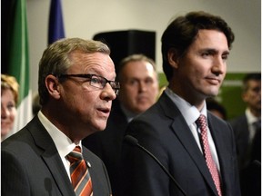 Saskatchewan Premier Brad Wall (left) and Prime Minister Justin Trudeau at a First Ministers meeting at the Canadian Museum of Nature in Ottawa on Nov. 23, 2015.