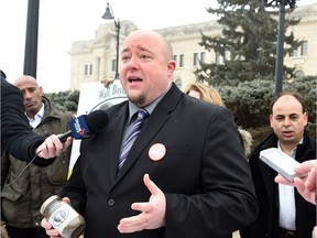 Terry Bell, former Saskatchewan NDP candidate for Regina Walsh Acres, speaks to the media out front of the Saskatchewan Legislative building on Feb. 18.