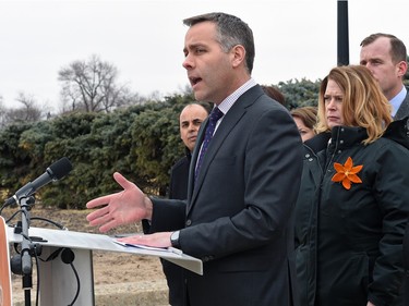 NDP Leader Cam Broten, surrounded by Regina NDP candidates, makes a campaign announcement in front of the Saskatchewan Legislative building in Regina, March 8, 2016.