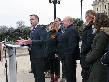 NDP Leader Cam Broten, surrounded by Regina NDP candidates, makes a campaign announcement in front of the Saskatchewan Legislative building in Regina, March 8, 2016.