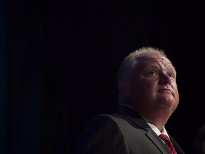 Mayor Rob Ford pauses while participating in a mayoral debate in Toronto on July 15, 2014. Former Toronto Mayor Rob Ford, whose scandal-plagued time in office made him an international celebrity, has died.