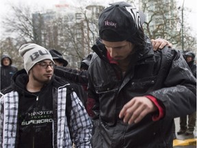 Saskatchewan men Charles Neil Curley, left, and Jeremy Roy walk together as they arrive in Vancouver, B.C., Wednesday, March. 9, 2016.