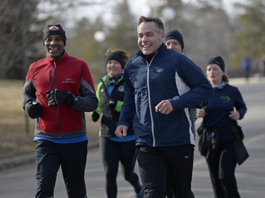 Saskatchewan NDP candidate Ted Jaleta (L), party leader Cam Broten (C) and other candidates go for a run around Wascana Lake in Regina, March 20, 2016.