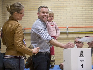 Saskatchewan NDP leader Cam Broten, with his wife Ruth, and daughters one-year-old Gudrun, five-year-old Ingrid and three-year-old Clara (R), votes at the advance poll at Ecole Henry Kelsey School in Saskatoon, March 29, 2016.