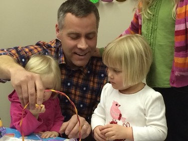 Saskatchewan NDP leader Cam Broten decorated eggs with children at his party's campaign office in Saskatoon, March 26, 2016.