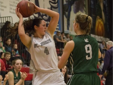 St. Joseph Guardians Alli Bristow attempts a pass against the Holy Cross Crusaders in the City girls high school basketball city final at Bedford Road Collegiate on Saturday, March 12th, 2016.